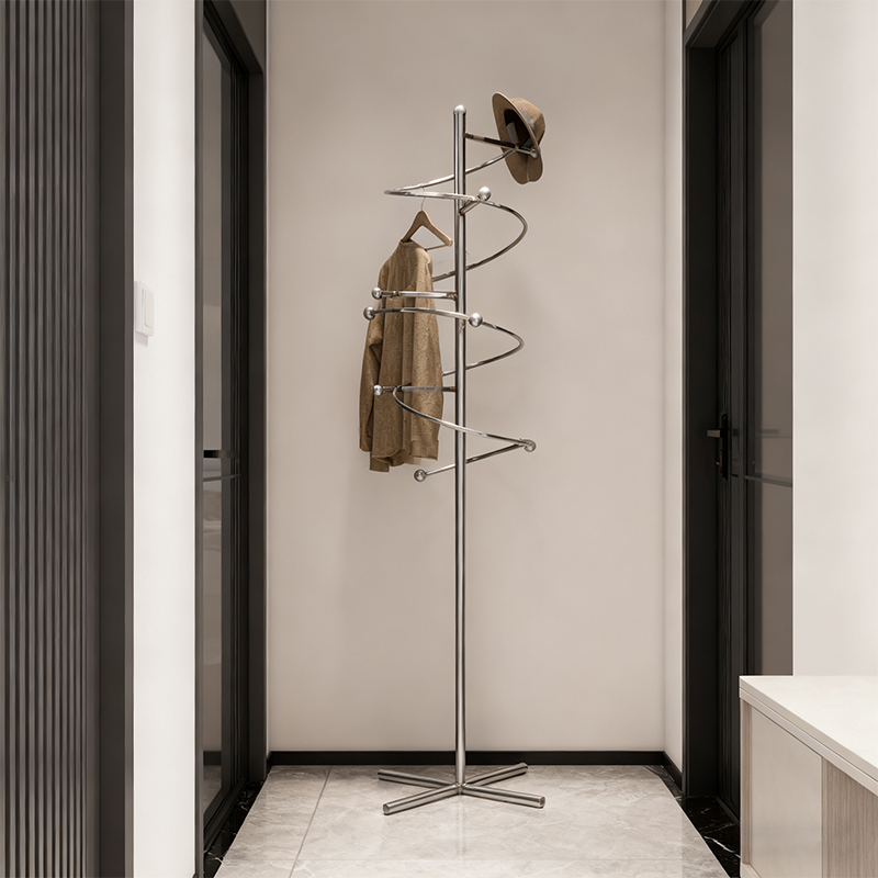 How does a spiral titanium alloy coat rack define modern home and spatial aesthetics?